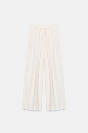 Брюки свободного кроя с регулируемыми манжетами- Заказать в России