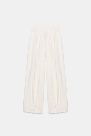 Брюки свободного кроя с регулируемыми манжетами- Заказать в России