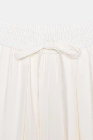 Брюки свободного кроя с регулируемыми манжетами- Заказать в России