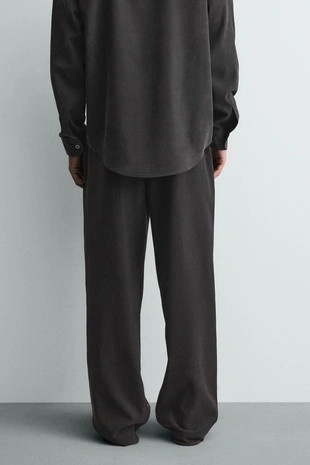 Струящиеся брюки Relaxed Fit- Заказать в России