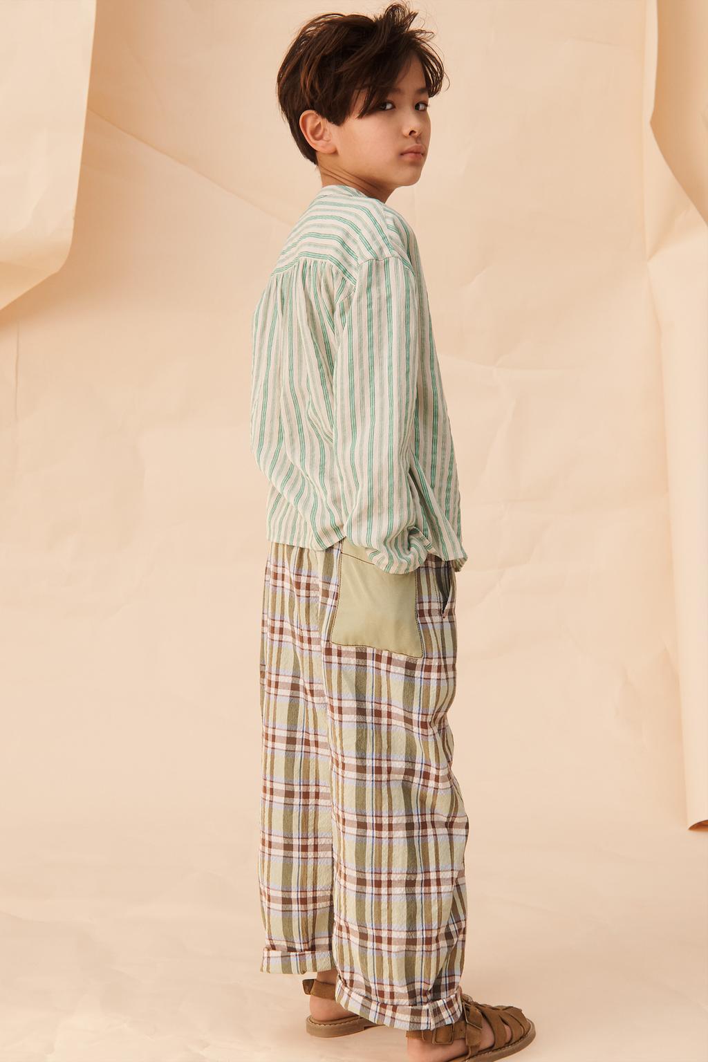 Брюки в клетку limited edition с контрастным карманом