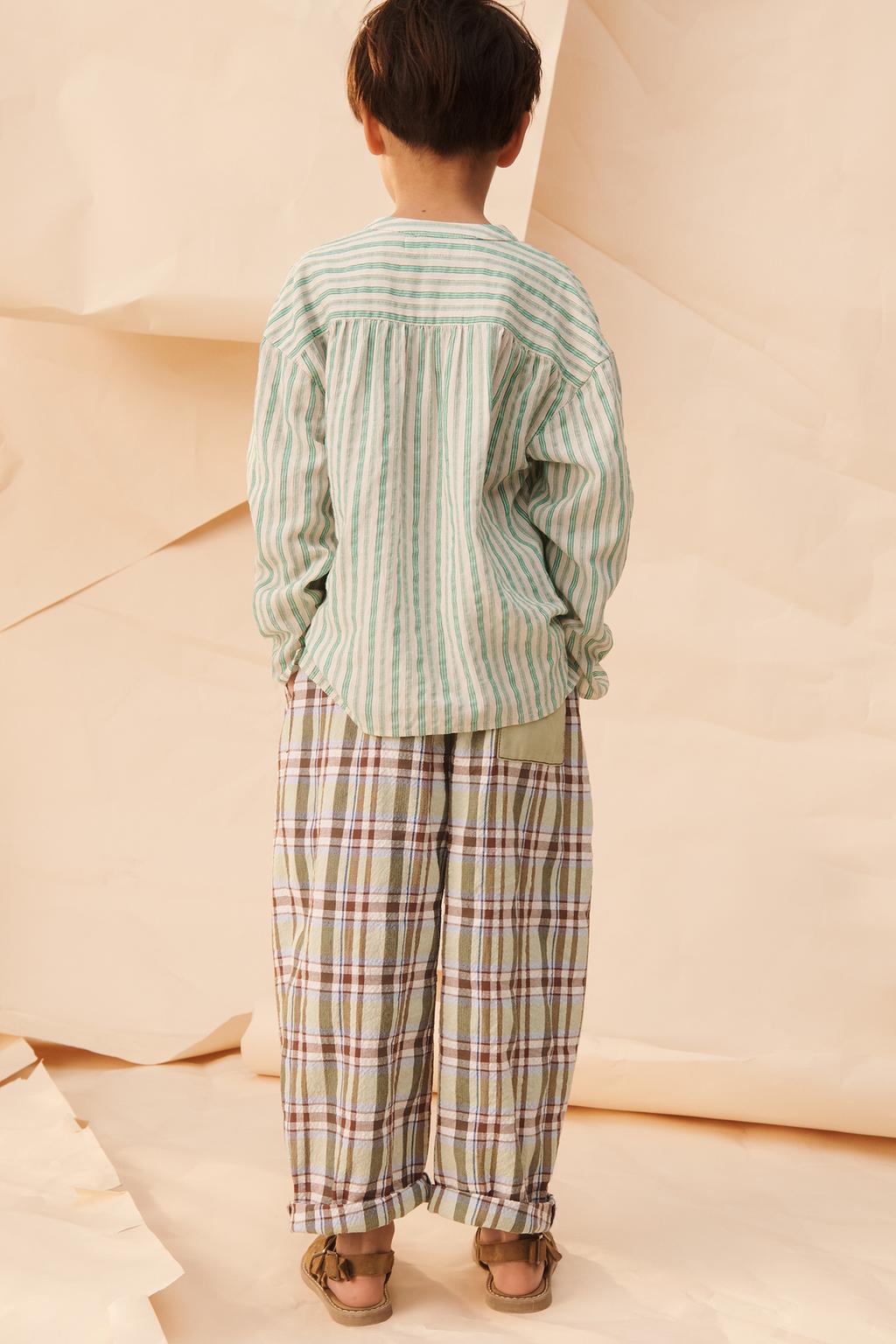 Брюки в клетку limited edition с контрастным карманом