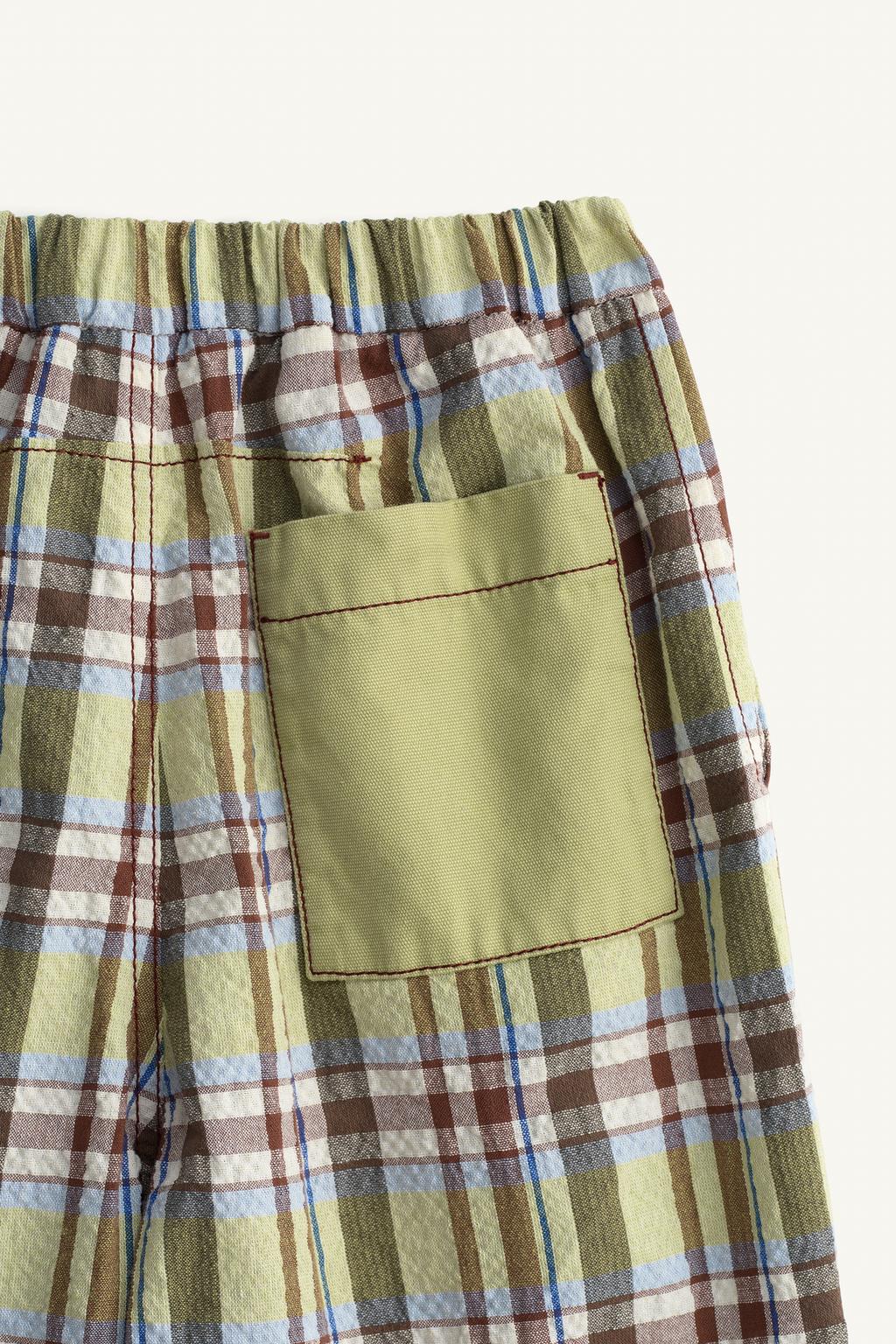 Брюки в клетку limited edition с контрастным карманом