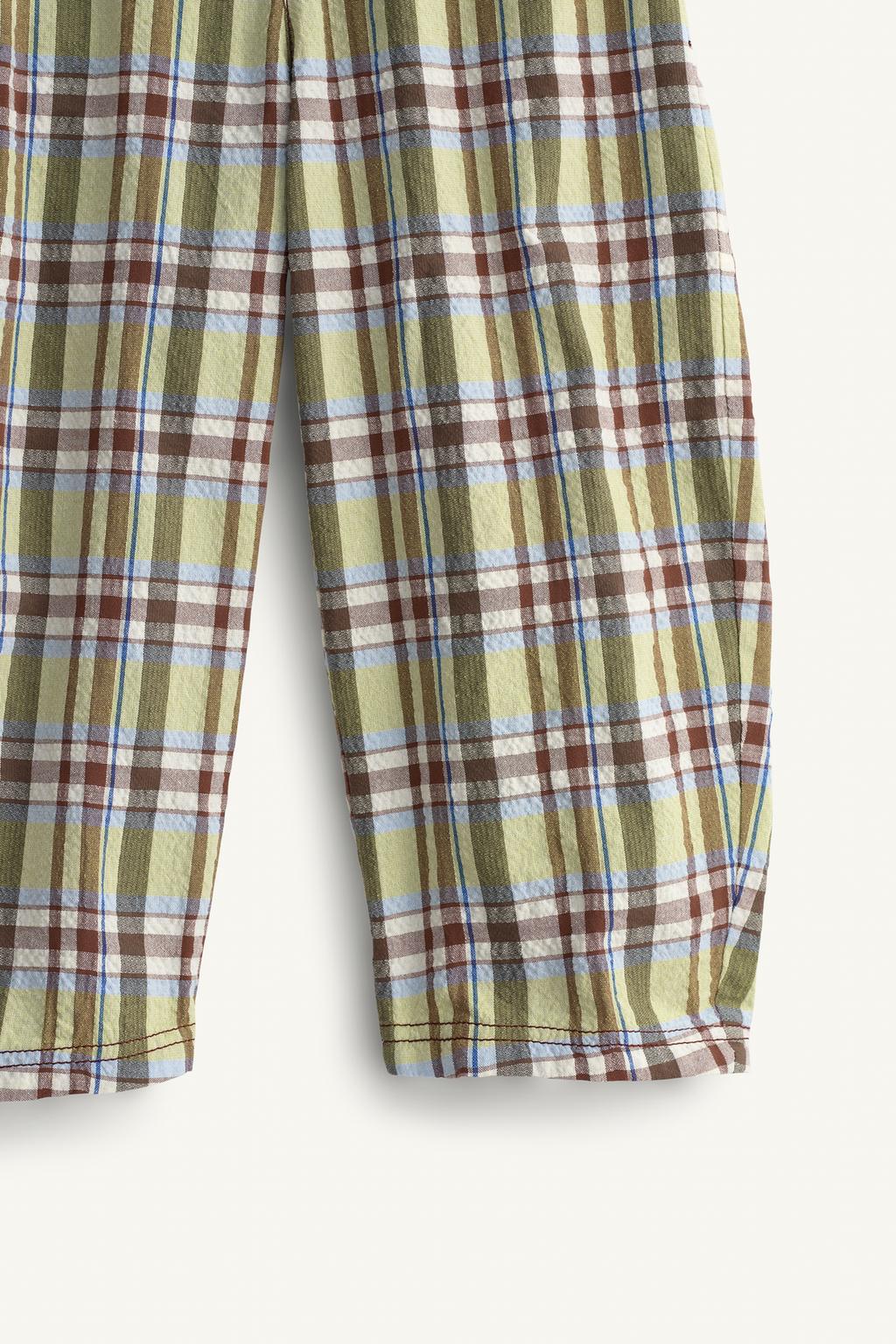 Брюки в клетку limited edition с контрастным карманом