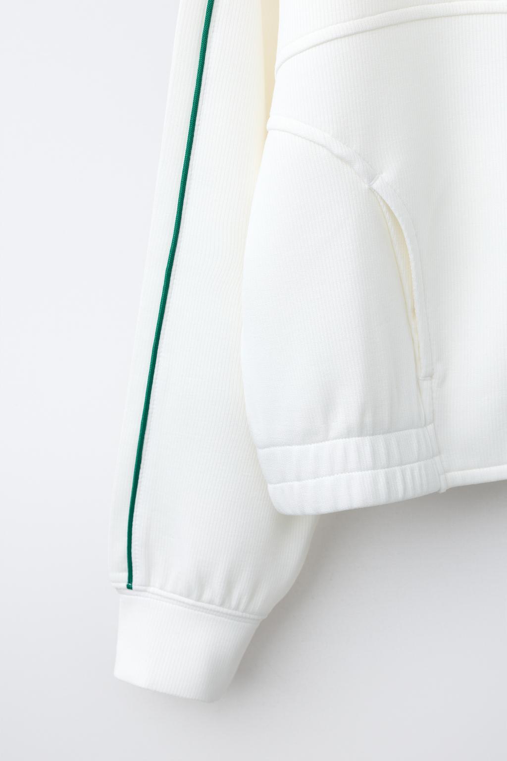 ТОЛСТОВКА С КОНТРАСТНОЙ ОТДЕЛКОЙ В РУБЧИК И МОЛНИЕЙ