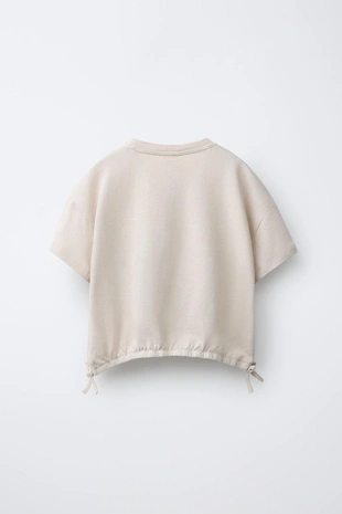 Комплект из футболки с завязками и брюк-джоггеров- Заказать в России