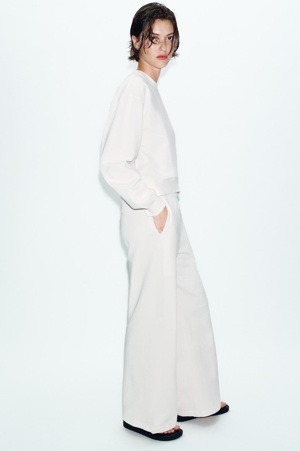 ШИРОКИЕ БРЮКИ С ЭФФЕКТОМ ПОТЕРТОСТИ