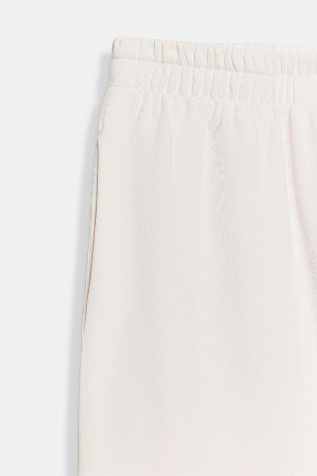 ШИРОКИЕ БРЮКИ С ЭФФЕКТОМ ПОТЕРТОСТИ