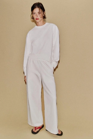 Широкие брюки с эффектом потертости- Заказать в России