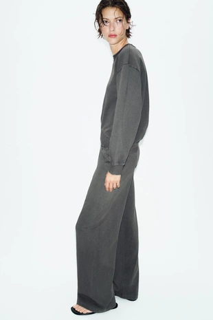 Широкие брюки с эффектом потертости- Заказать в России