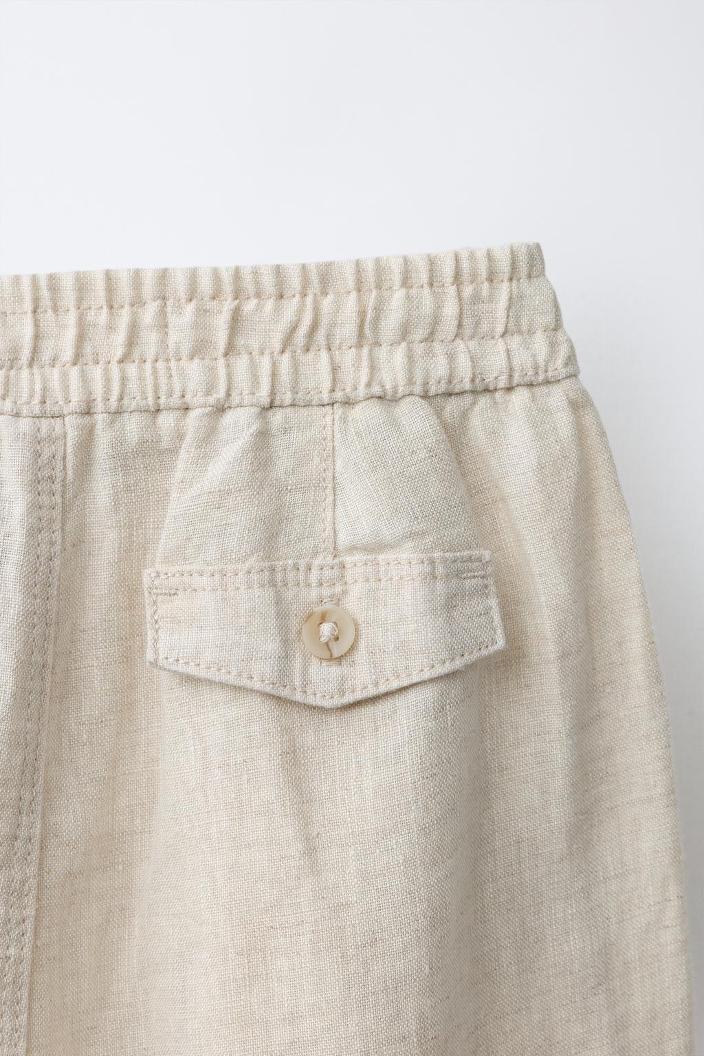 БРЮКИ С ЗАЩИПАМИ ИЗ 100% ЛЬНА