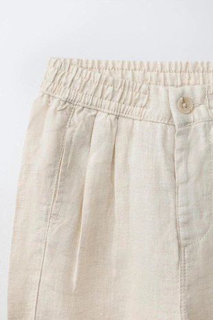 Брюки с защипами из 100% льна