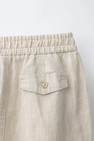 Брюки с защипами из 100% льна