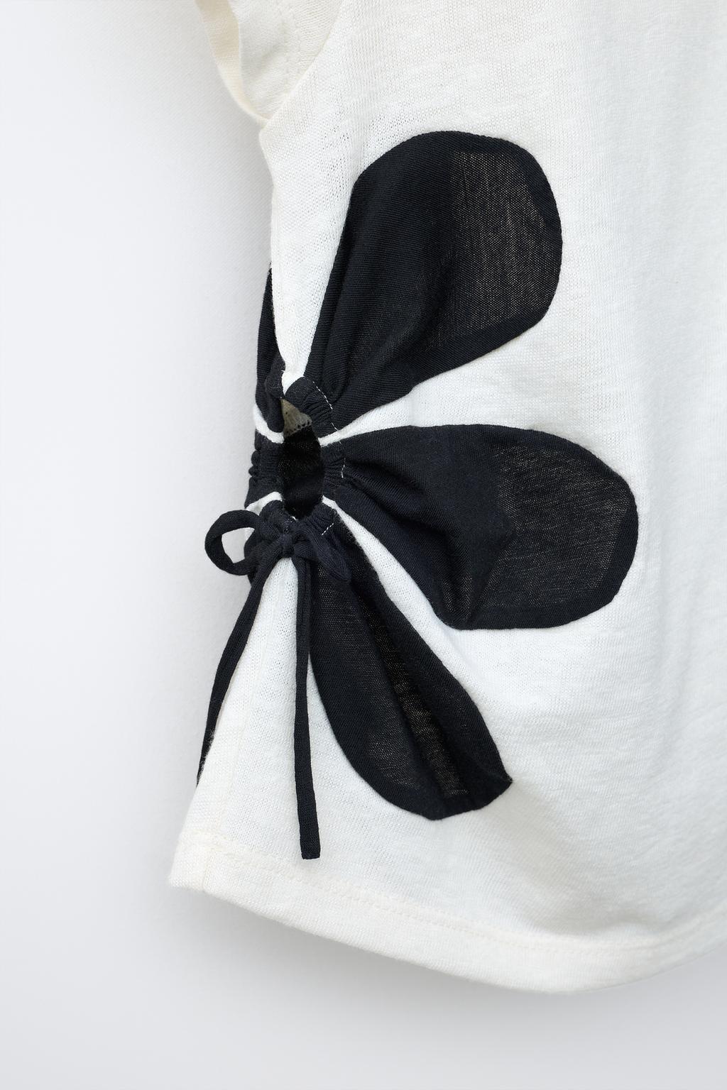 ФУТБОЛКА С ЦВЕТОЧНЫМ ПРИНТОМ И ВЫРЕЗАМИ