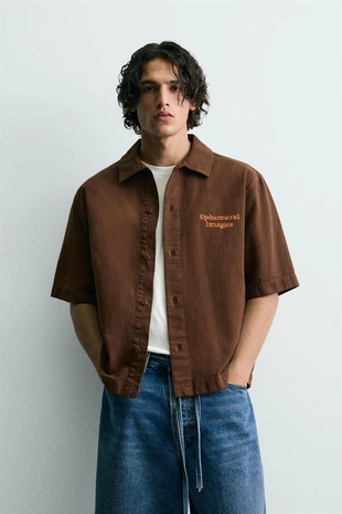 Рубашка с контрастным принтом и эффектом потертости