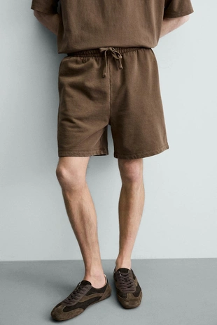 Шорты-джоггеры из ткани с эффектом потертости- Заказать в России