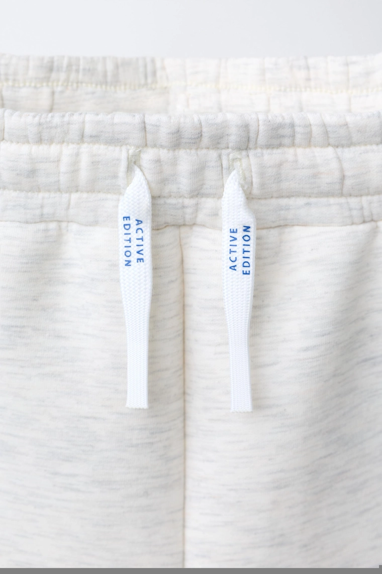 Спортивные бермуды с логотипом из неопрена