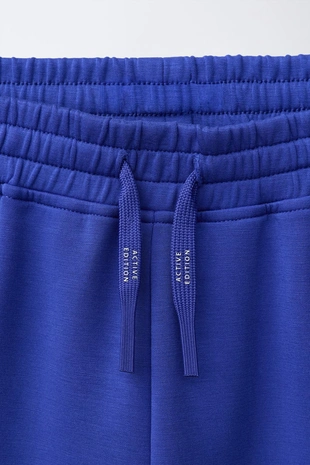 Спортивные шорты-бермуды с логотипом- Заказать в России