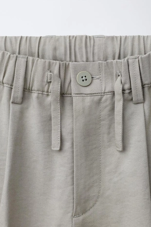 Брюки свободного кроя с защипами- Заказать в России