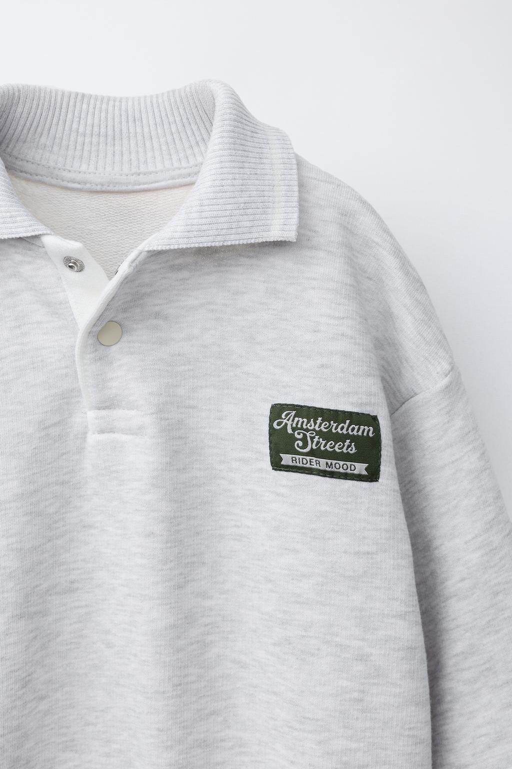 ТОЛСТОВКА ПОЛО С ВЫШИТОЙ НАШИВКОЙ