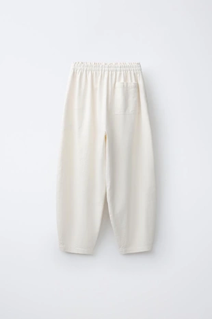 Шаровые брюки с эластичным поясом и аппликацией-шнурком спереди- Заказать в России