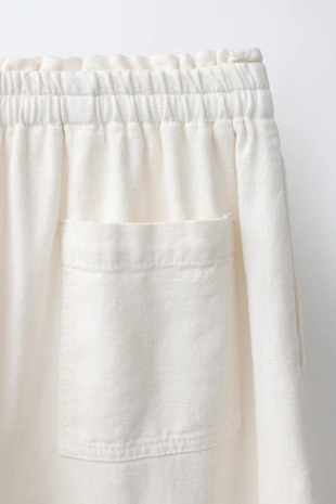 Шаровые брюки с эластичным поясом и аппликацией-шнурком спереди- Заказать в России