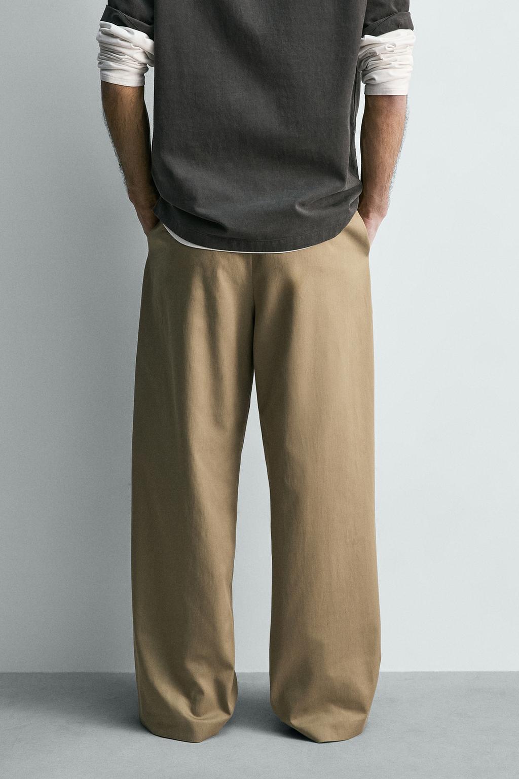 СВОБОДНЫЕ БРЮКИ С ЗАЩИПАМИ И РЕМНЕМ