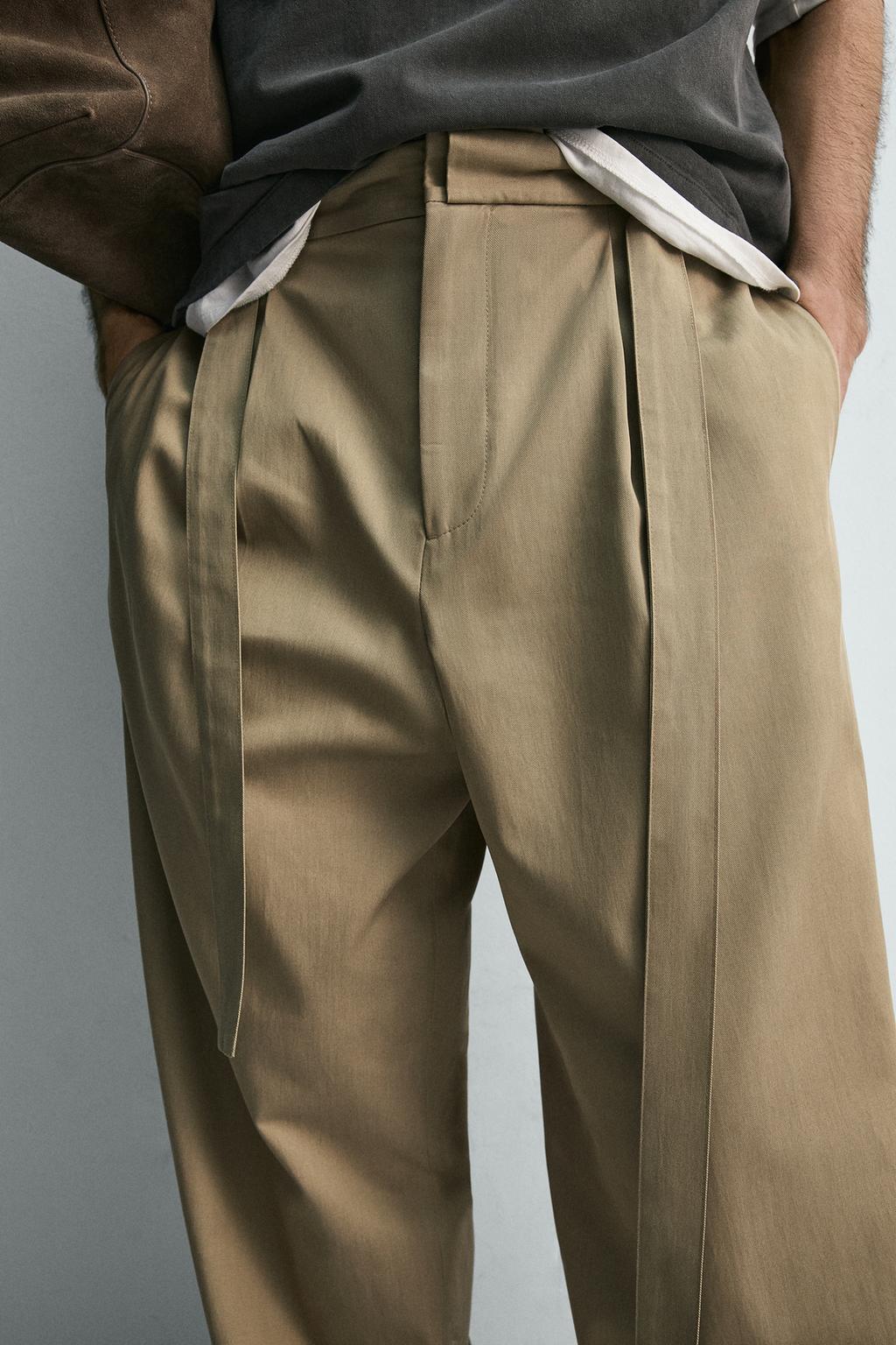 СВОБОДНЫЕ БРЮКИ С ЗАЩИПАМИ И РЕМНЕМ