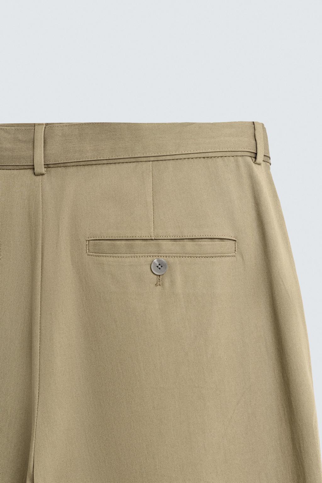 СВОБОДНЫЕ БРЮКИ С ЗАЩИПАМИ И РЕМНЕМ