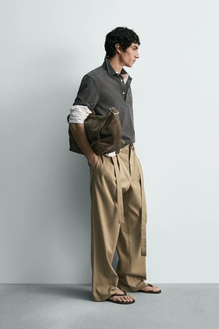 Свободные брюки с защипами и ремнем- Заказать в России