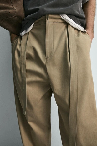 Свободные брюки с защипами и ремнем- Заказать в России