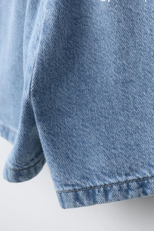 Короткий джинсовый комбинезон с бантиками- Заказать в России