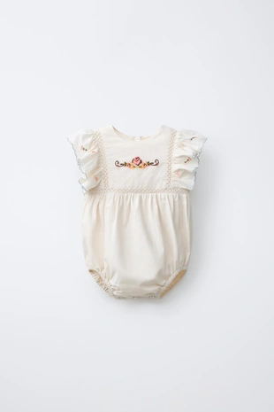 Комбинезон с вышитым цветком- Заказать в России