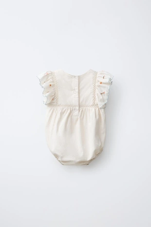 Комбинезон с вышитым цветком- Заказать в России