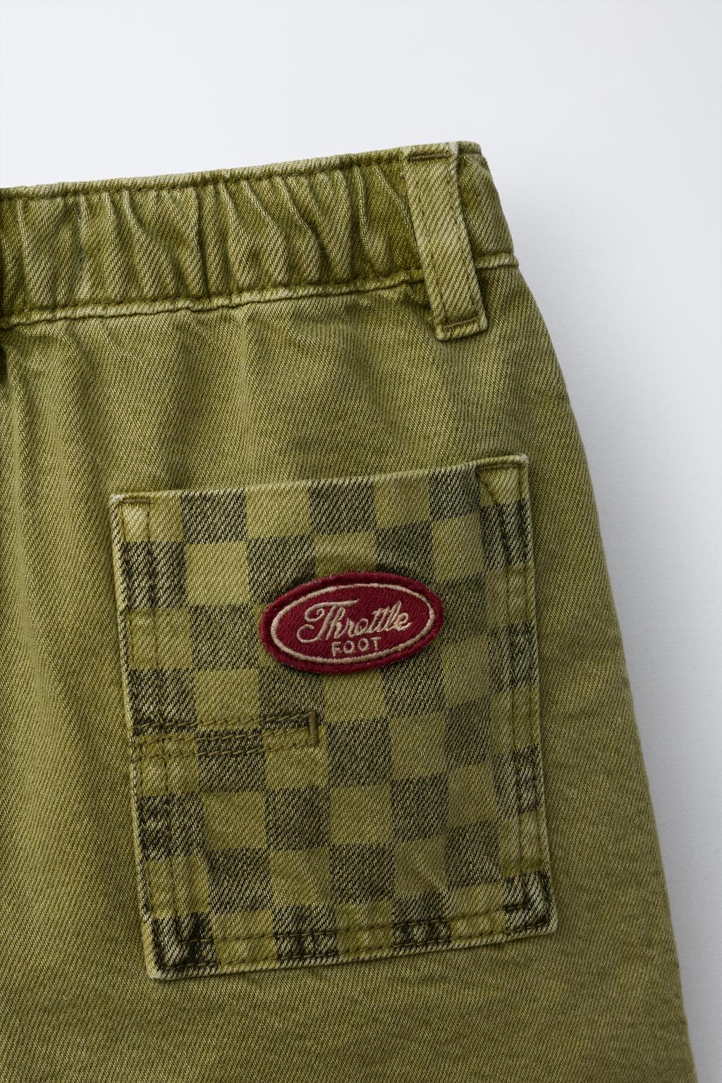 БЕРМУДЫ ИЗ САРЖИ В КЛЕТКУ С КАРМАНАМИ