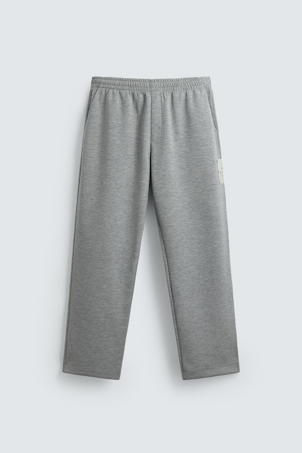 БРЮКИ С НАШИВКОЙ И ЭТИКЕТКОЙ