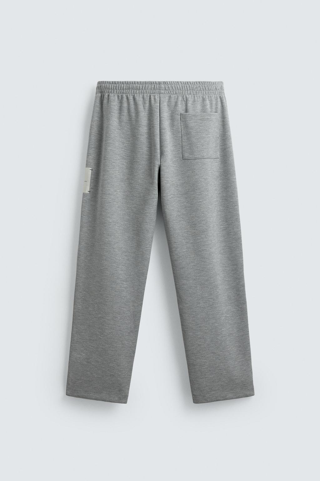 БРЮКИ С НАШИВКОЙ И ЭТИКЕТКОЙ