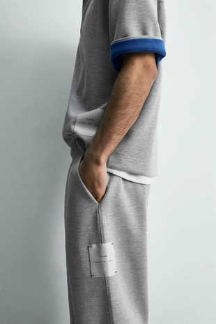 Брюки с нашивкой и этикеткой- Заказать в России