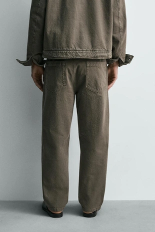 Брюки Relaxed Fit с эффектом потертости- Заказать в России