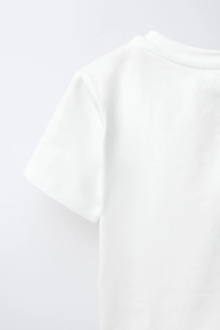 Футболка с бантом и бусинами