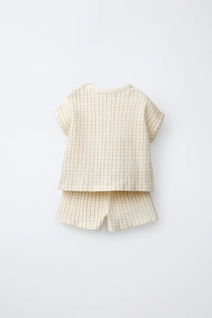 Комплект из футболки и шортов в клетку- Заказать в России