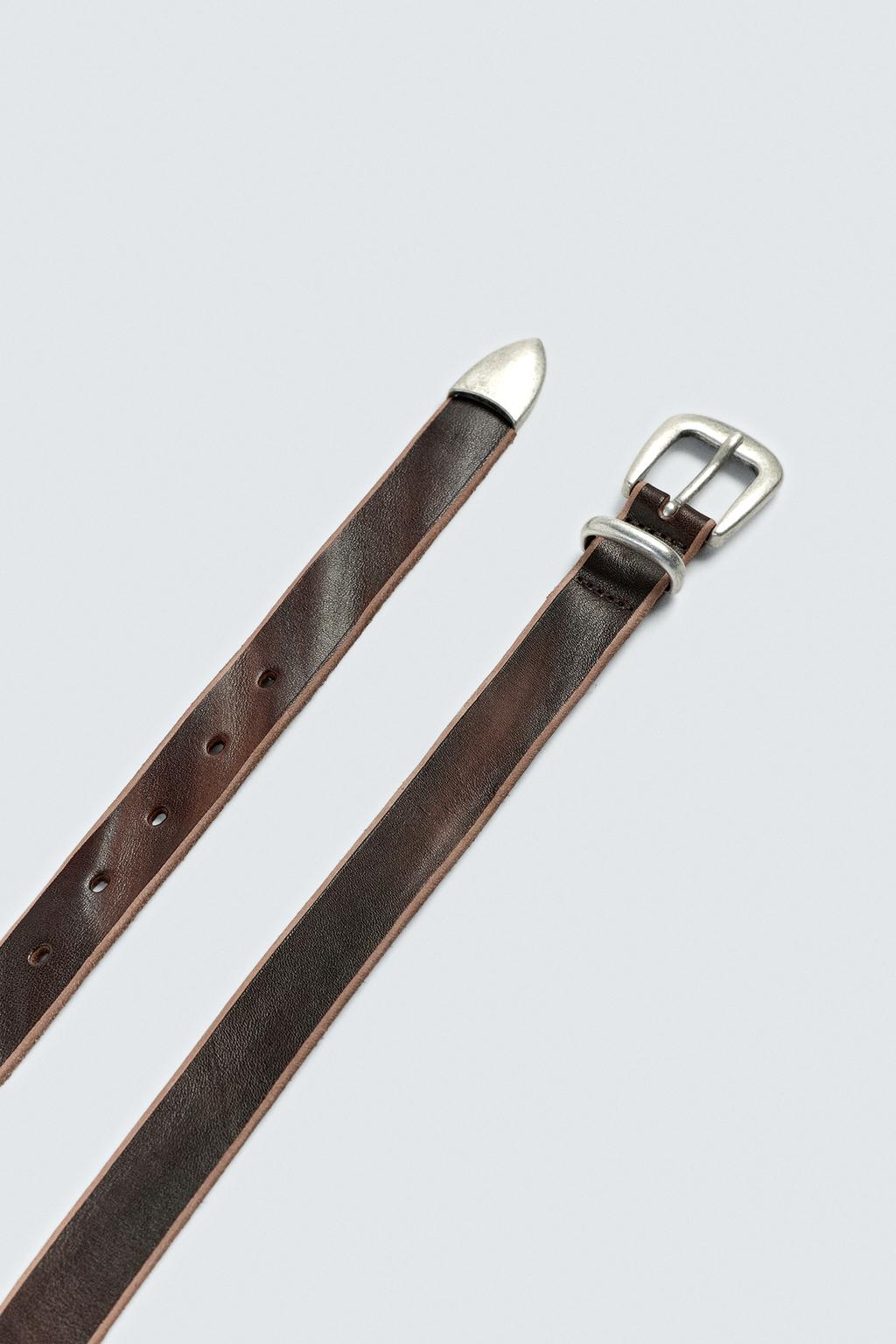 РЕМЕНЬ ИЗ КОЖИ С МЕТАЛЛИЧЕСКИМ НАКОНЕЧНИКОМ