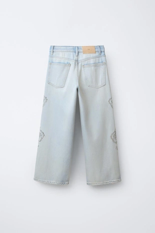 Джинсы Wide Leg с цветочным принтом и стразами- Заказать в России