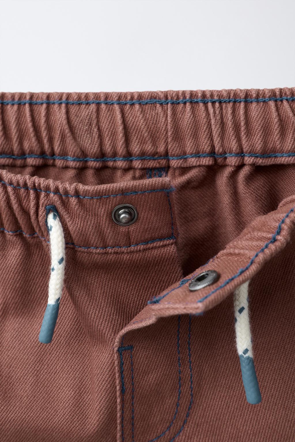 ШОРТЫ-БЕРМУДЫ С КОНТРАСТНОЙ СТРОЧКОЙ