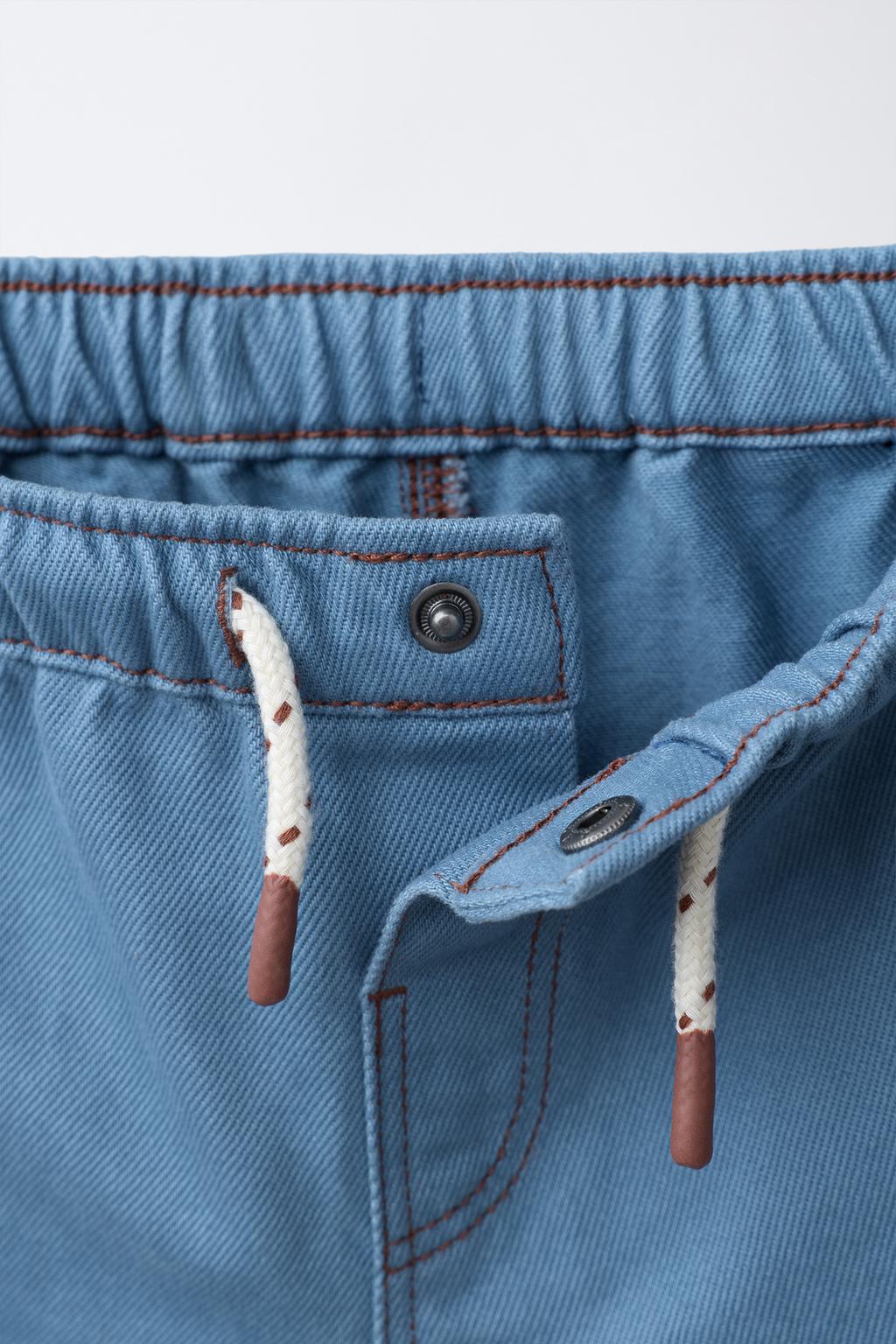 ШОРТЫ-БЕРМУДЫ С КОНТРАСТНОЙ СТРОЧКОЙ