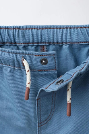 Шорты-бермуды с контрастной строчкой- Заказать в России