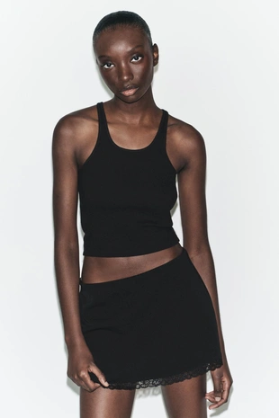 Мини-юбка из эластичной ткани с кружевом- Заказать в России