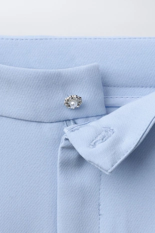 Костюмные брюки с декоративной пуговицей- Заказать в России