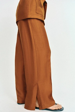 Брюки свободного кроя из смесового льна с разрезами по низу- Заказать в России