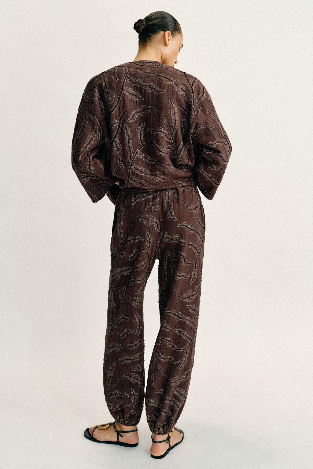 ШАРОВАРЫ ИЗ МЕТАЛЛИЗИРОВАННОЙ ТКАНИ С ПАЙЕТКАМИ